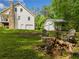 Backyard of home showing fire pit with chairs and two car detached garage at 1822 Morgan Rd, Canton, GA 30115
