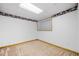The basement has carpet flooring and is decorated with floral wallpaper border at 1822 Morgan Rd, Canton, GA 30115