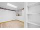The basement has carpet flooring, built-in shelving, and is decorated with floral wallpaper border at 1822 Morgan Rd, Canton, GA 30115