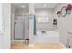Bright bathroom featuring a shower and a soaking tub with white cabinets and a decor at 1822 Morgan Rd, Canton, GA 30115