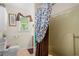 Cozy bathroom with shower/tub combination and decorative blue and brown shower curtain at 1822 Morgan Rd, Canton, GA 30115