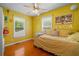 Bright bedroom with wood floors and ample natural light through two windows at 1822 Morgan Rd, Canton, GA 30115