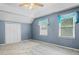 This spacious bedroom has vaulted ceilings, carpet flooring, and a light blue paint color at 1822 Morgan Rd, Canton, GA 30115