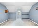 This bedroom has vaulted ceilings, carpet flooring, and a light blue paint color at 1822 Morgan Rd, Canton, GA 30115
