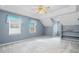 Spacious bonus room with carpet, ample lighting, and a view of the window at 1822 Morgan Rd, Canton, GA 30115