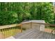 Wooden deck overlooking private wooded backyard and garage at 1822 Morgan Rd, Canton, GA 30115
