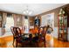 A beautiful dining room with wood floors, a round table, and a chandelier at 1822 Morgan Rd, Canton, GA 30115