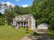 Charming two-story home with inviting front porch, two car garage and lush landscaping at 1822 Morgan Rd, Canton, GA 30115