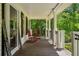Inviting front porch featuring classic rocking chairs and a 'Home Sweet Home' sign, perfect for relaxing outdoors at 1822 Morgan Rd, Canton, GA 30115