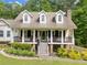 Charming two-story home with inviting front porch and black railings at 1822 Morgan Rd, Canton, GA 30115