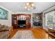 Inviting living room features a stone fireplace, hardwood floors and a beautiful built-in entertainment center at 1822 Morgan Rd, Canton, GA 30115