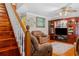 Cozy living room with hardwood floors, staircase and comfortable seating at 1822 Morgan Rd, Canton, GA 30115