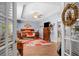 Spacious primary bedroom featuring trey ceiling, hardwood floors, and a sitting area with bench at 1822 Morgan Rd, Canton, GA 30115