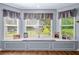 Cozy window seat with three windows, offering natural light and backyard views at 1822 Morgan Rd, Canton, GA 30115