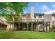 Expansive backyard features a large deck, patio, and well-maintained lawn at 5415 Old Haven Ct, Cumming, GA 30041