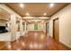 Large basement featuring hardwood floors, white columns, and recessed lighting at 5415 Old Haven Ct, Cumming, GA 30041