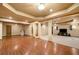 Large basement with hardwood and carpet areas, recessed lights, and columns at 5415 Old Haven Ct, Cumming, GA 30041