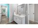 Bathroom showcasing an updated white vanity with a framed mirror and neutral paint at 5415 Old Haven Ct, Cumming, GA 30041