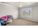 Bedroom featuring neutral paint and a window with lawn views at 5415 Old Haven Ct, Cumming, GA 30041