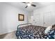 Bedroom with carpet, ceiling fan, and a floral patterned bedspread at 5415 Old Haven Ct, Cumming, GA 30041
