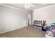 Bonus room with neutral paint, a ceiling fan and an organization center at 5415 Old Haven Ct, Cumming, GA 30041