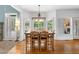 Charming dining area features hardwood floors, plantation shutters, and a stylish chandelier at 5415 Old Haven Ct, Cumming, GA 30041