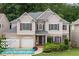 Charming two-story home featuring a brick-and-siding facade, manicured landscaping, and a welcoming two-car garage at 5415 Old Haven Ct, Cumming, GA 30041
