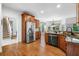 Spacious kitchen features stainless steel appliances, granite counters, and wooden cabinets at 5415 Old Haven Ct, Cumming, GA 30041