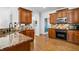 Well-equipped kitchen with granite countertops, stainless steel appliances, and ample cabinet space at 5415 Old Haven Ct, Cumming, GA 30041
