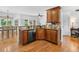 Open concept kitchen with granite countertops, a breakfast bar, and stainless steel appliances at 5415 Old Haven Ct, Cumming, GA 30041