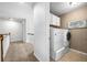 Bright laundry room with updated washer, dryer and decor at 5415 Old Haven Ct, Cumming, GA 30041