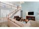 Comfortable living room with a staircase, high ceilings, and cozy furnishings at 5415 Old Haven Ct, Cumming, GA 30041