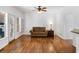 Bright living room has hardwood floors, natural light, and walkout to the outdoor patio or porch at 5415 Old Haven Ct, Cumming, GA 30041