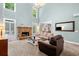 Bright living room boasts a stone fireplace, large windows, and an open layout at 5415 Old Haven Ct, Cumming, GA 30041