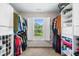 Spacious walk-in closet with custom shelving and a window for natural light at 5415 Old Haven Ct, Cumming, GA 30041