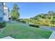 Backyard view featuring a lush lawn and a serene lake, creating a tranquil setting at 1943 Blue Heron Way, Lawrenceville, GA 30043