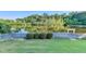 Spacious backyard with a manicured lawn and peaceful lake view, ideal for outdoor enjoyment at 1943 Blue Heron Way, Lawrenceville, GA 30043