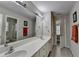 Spacious bathroom features a dual sink vanity, large mirror, and modern fixtures at 1943 Blue Heron Way, Lawrenceville, GA 30043