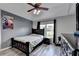 Well-lit bedroom with ceiling fan, closet and hardwood flooring at 1943 Blue Heron Way, Lawrenceville, GA 30043