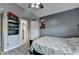 Modern bedroom features a ceiling fan, closet and hardwood flooring at 1943 Blue Heron Way, Lawrenceville, GA 30043