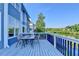 Deck showcases wood flooring and metal railing overlooking the lake at 1943 Blue Heron Way, Lawrenceville, GA 30043