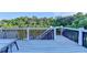 Open deck with a blue railing overlooking a lake, perfect for relaxing outdoors at 1943 Blue Heron Way, Lawrenceville, GA 30043