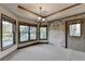 Dining room with abundant natural light, brick accent wall, and decorative chandelier at 1943 Blue Heron Way, Lawrenceville, GA 30043