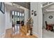 Elegant foyer with hardwood floors, staircase, and views into the living and dining areas at 1943 Blue Heron Way, Lawrenceville, GA 30043