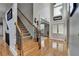 Spacious foyer features hardwood floors, staircase, and a view into adjacent rooms at 1943 Blue Heron Way, Lawrenceville, GA 30043