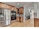 Well-equipped kitchen boasts stainless steel appliances, modern cabinetry, and convenient access to the staircase at 1943 Blue Heron Way, Lawrenceville, GA 30043