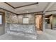 Living room with unique brick walls, a bar area, and recessed lighting, creating a cozy atmosphere at 1943 Blue Heron Way, Lawrenceville, GA 30043