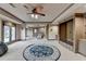 Large living room with neutral carpet, built in storage and access to the outdoors at 1943 Blue Heron Way, Lawrenceville, GA 30043