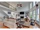 Open living room with a stone fireplace and staircase at 1943 Blue Heron Way, Lawrenceville, GA 30043