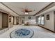 Open concept living room featuring neutral carpet, built in storage and natural light at 1943 Blue Heron Way, Lawrenceville, GA 30043